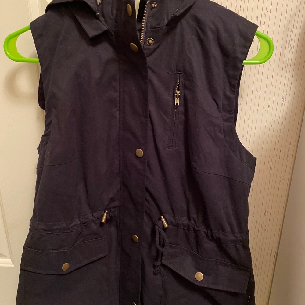 Black vest with removable hood and faux fur inside